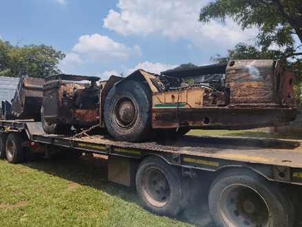 Worn mining LHD (load-haul-dump) machine before full equipment rebuild.