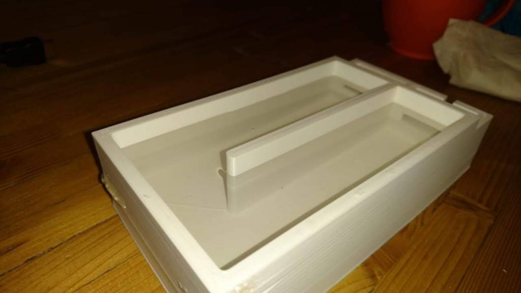 3D-printed biodigester prototype part designed using CAD, shown next to the printed component.