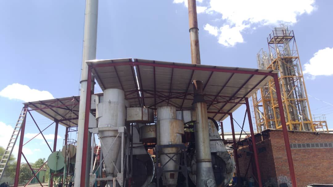 Steel support structure with vertical piping at an industrial structural project.